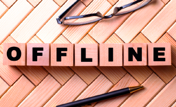 Image showing OFFLINE using scrabble tiles next to a pen and glasses